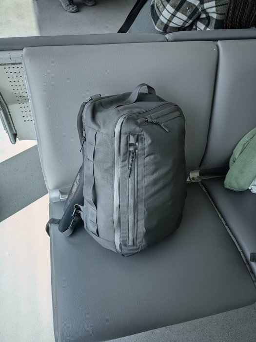 The bag on a airport waiting area seat